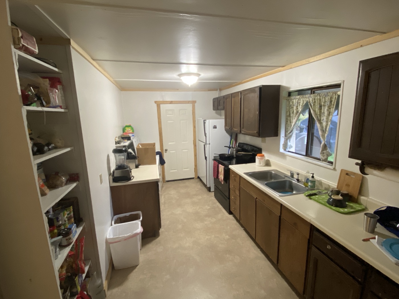 Kitchen before remodel with dark cabinets