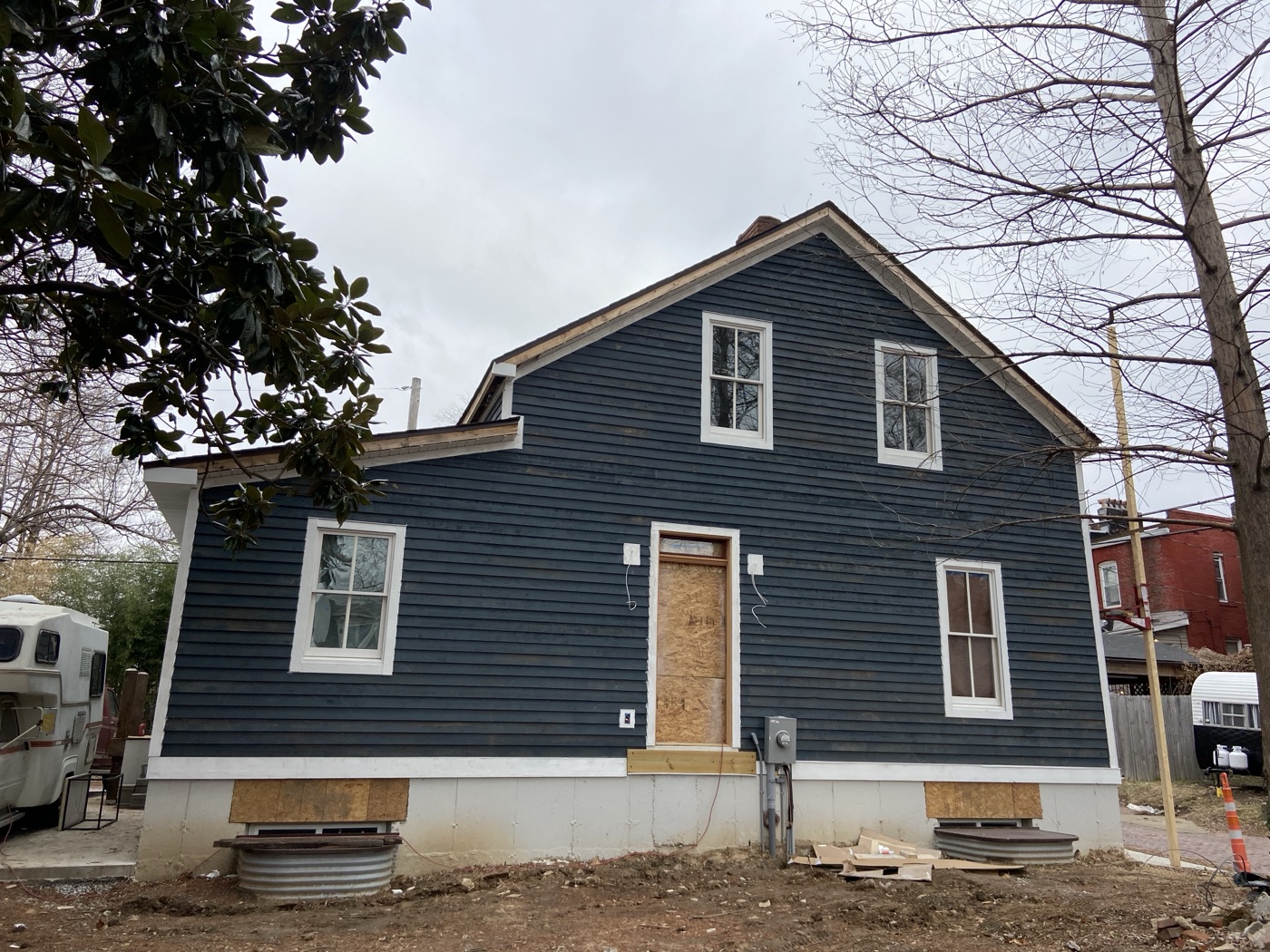 House exterior after navy blue siding installation